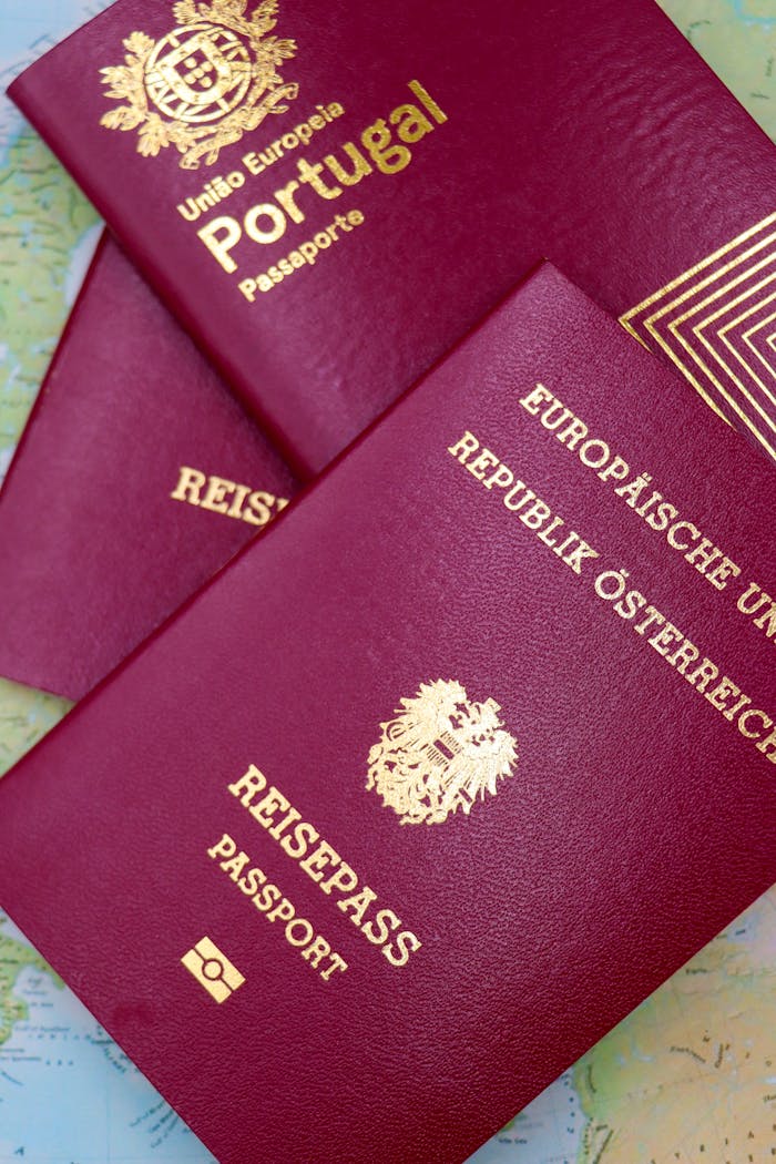 Close-up of Portugal and Austrian passports on a map, symbolizing travel and European mobility.
